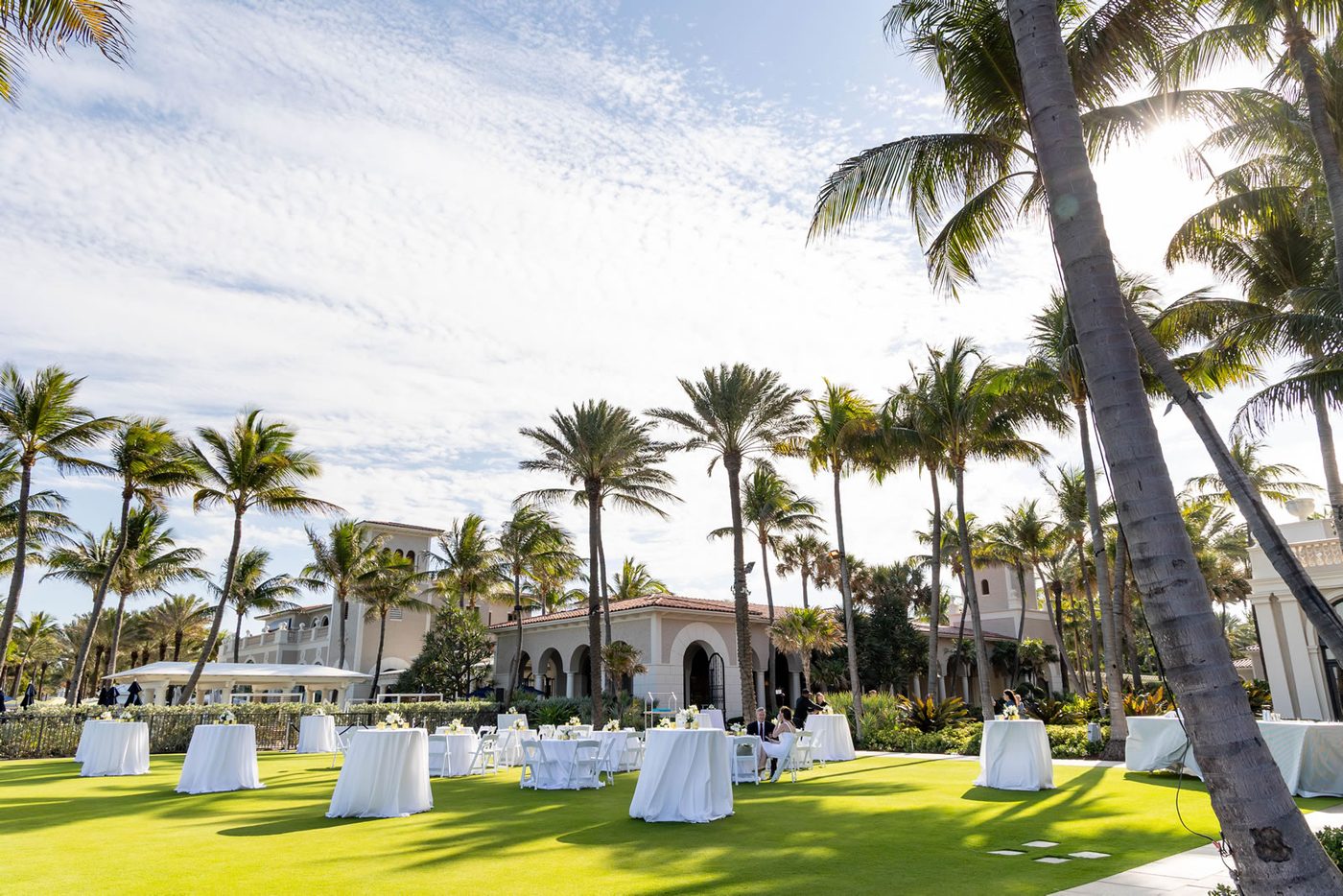 Ballroom dinner tables arranged with an ocean view at The Breakers